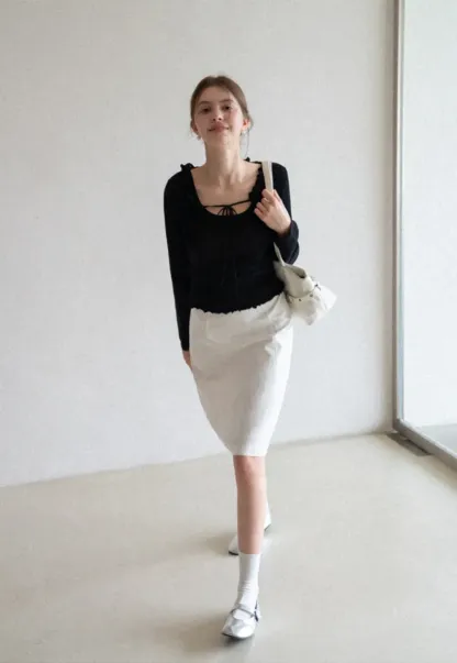 Woolen knit sweater with ruffles and tank top