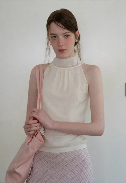 Pull sans manches en maille avec nœud papillon dans le dos