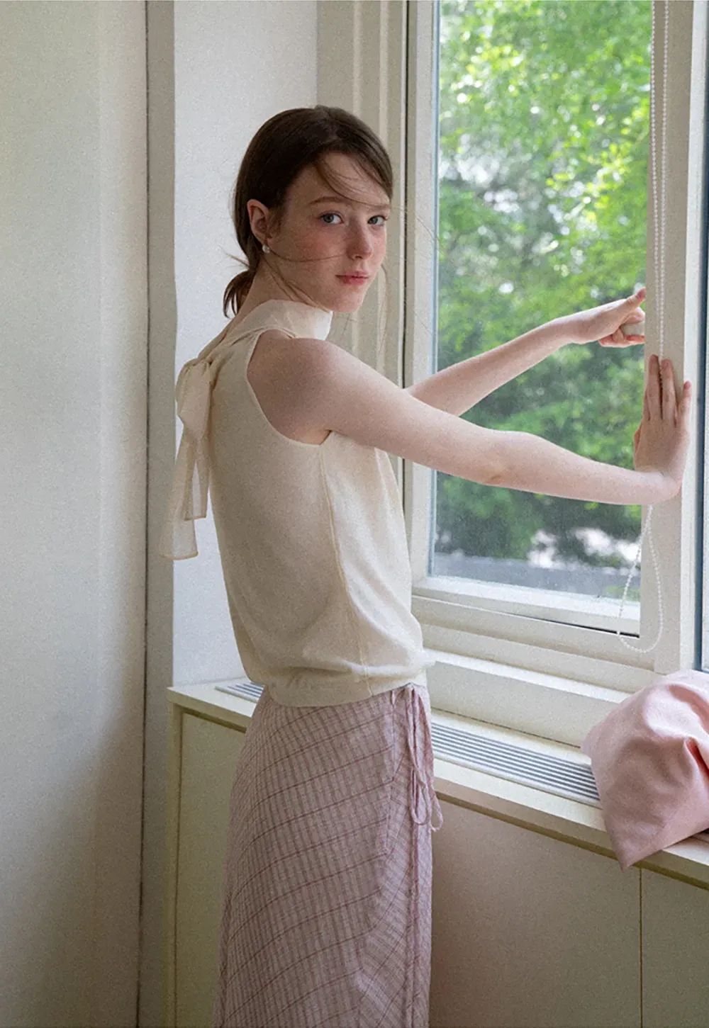 Pull sans manches en maille avec nœud papillon dans le dos