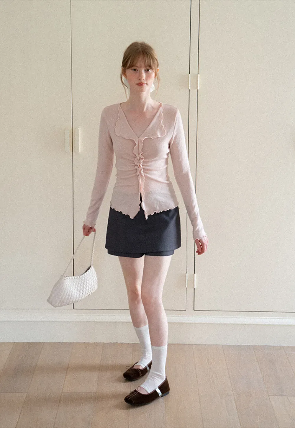 Ruffled V Neck Knit Sweater with Front Twist Detail