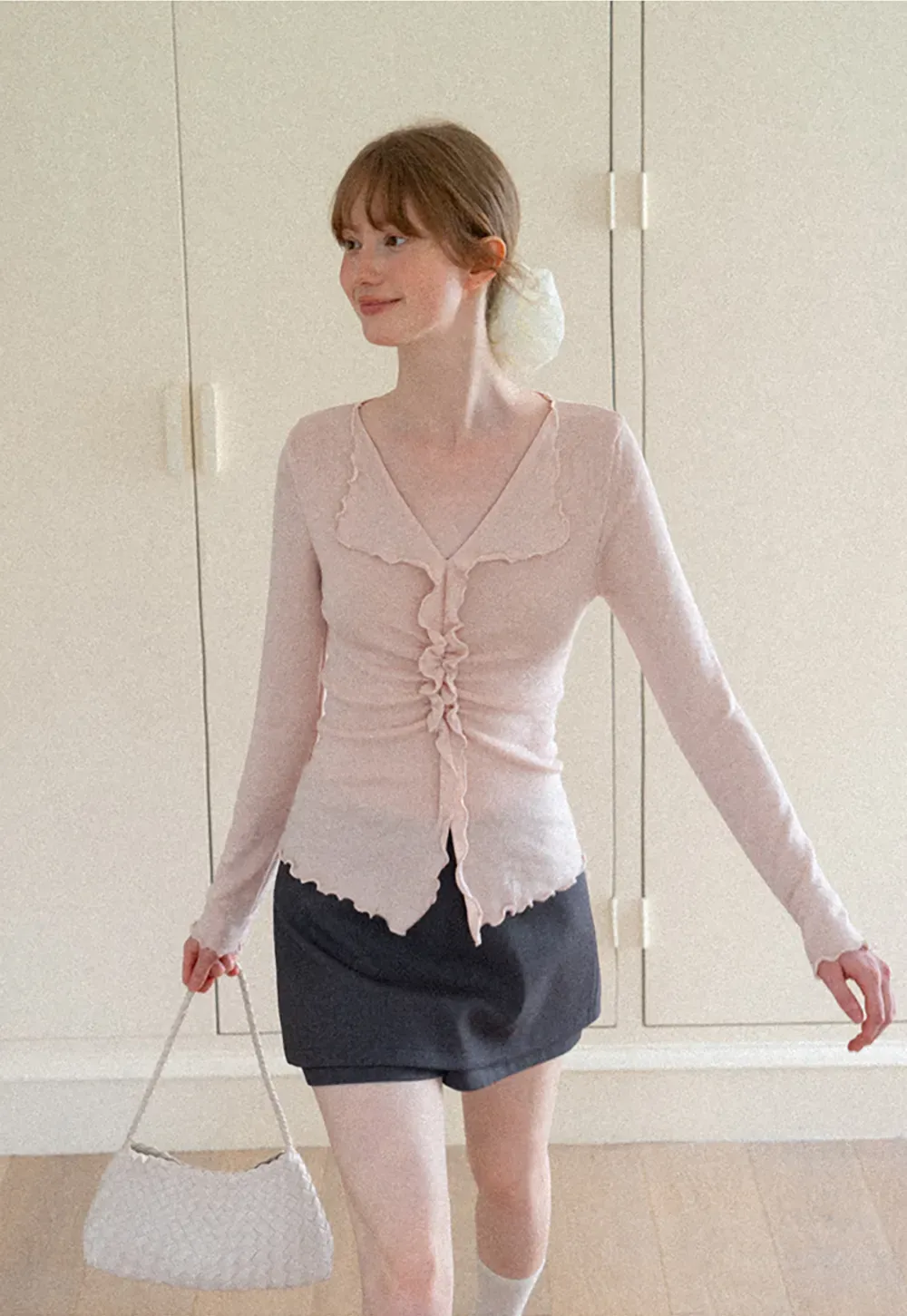 Ruffled V Neck Knit Sweater with Front Twist Detail