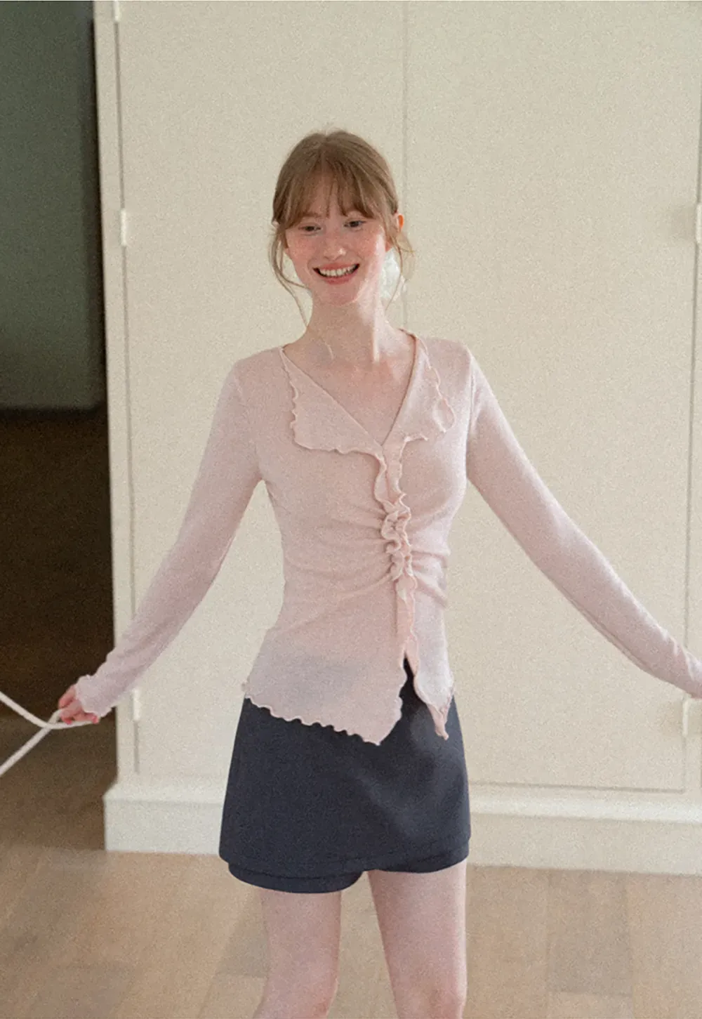 Ruffled V Neck Knit Sweater with Front Twist Detail