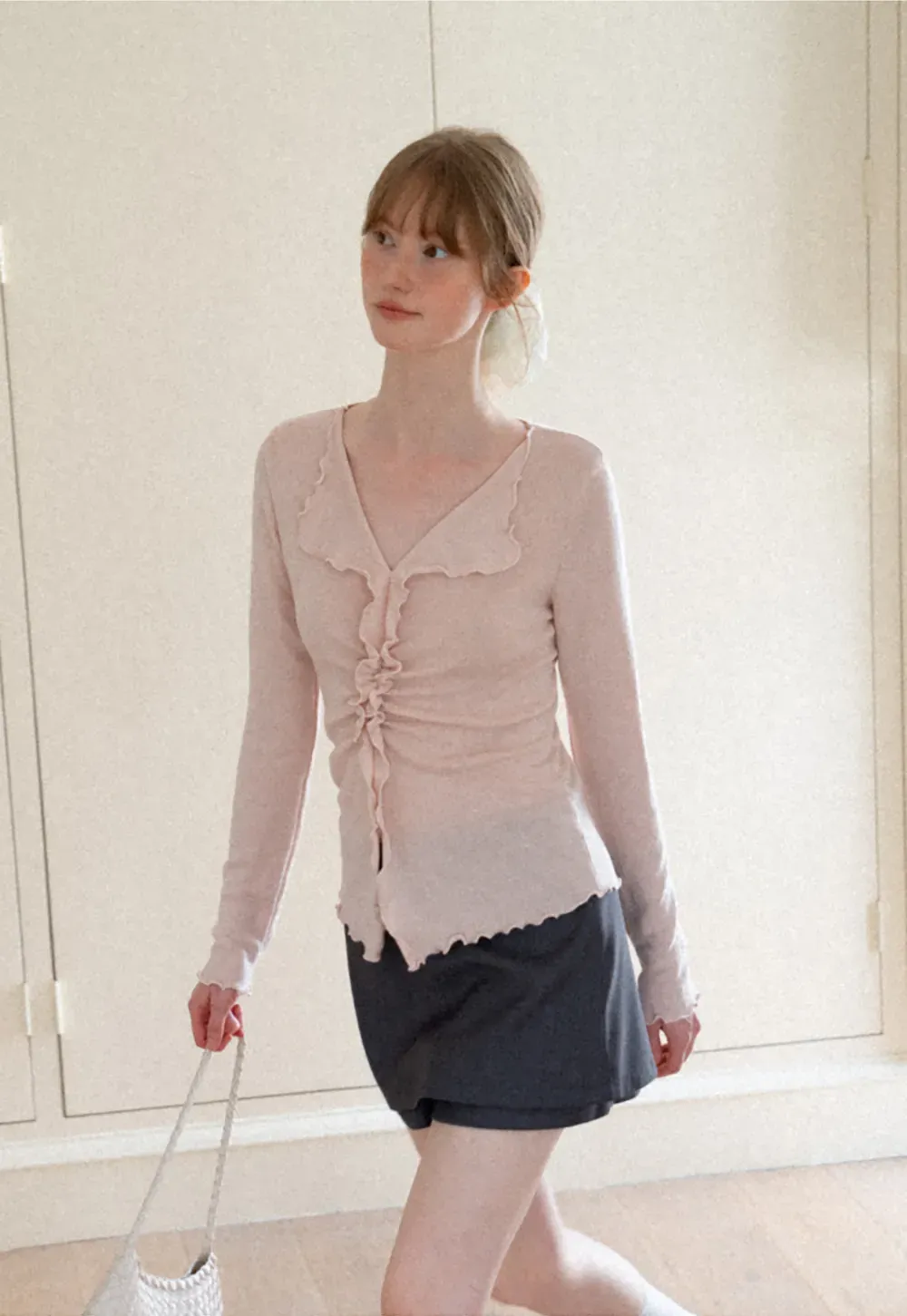 Ruffled V Neck Knit Sweater with Front Twist Detail