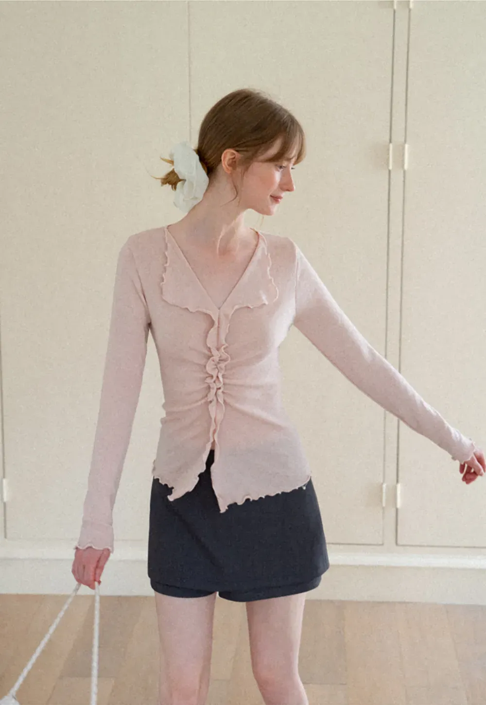 Ruffled V Neck Knit Sweater with Front Twist Detail