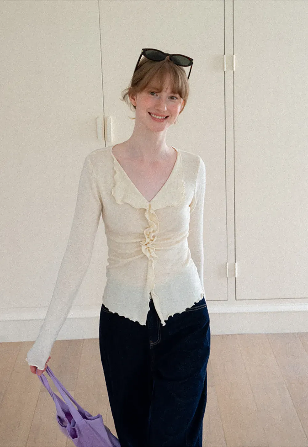 Ruffled V Neck Knit Sweater with Front Twist Detail