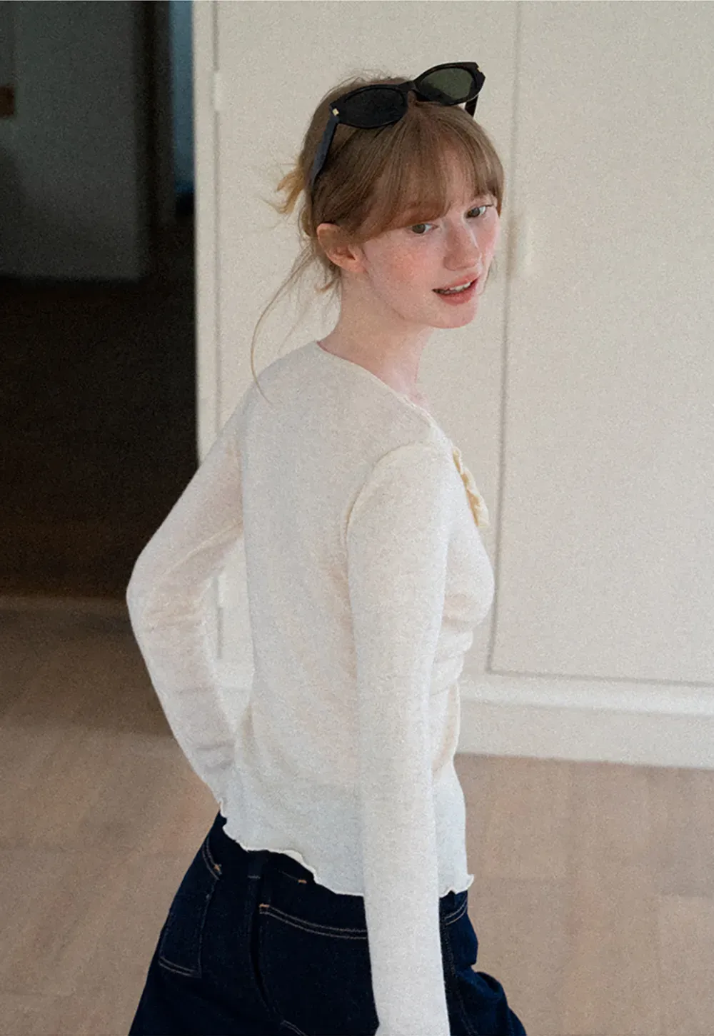 Ruffled V Neck Knit Sweater with Front Twist Detail