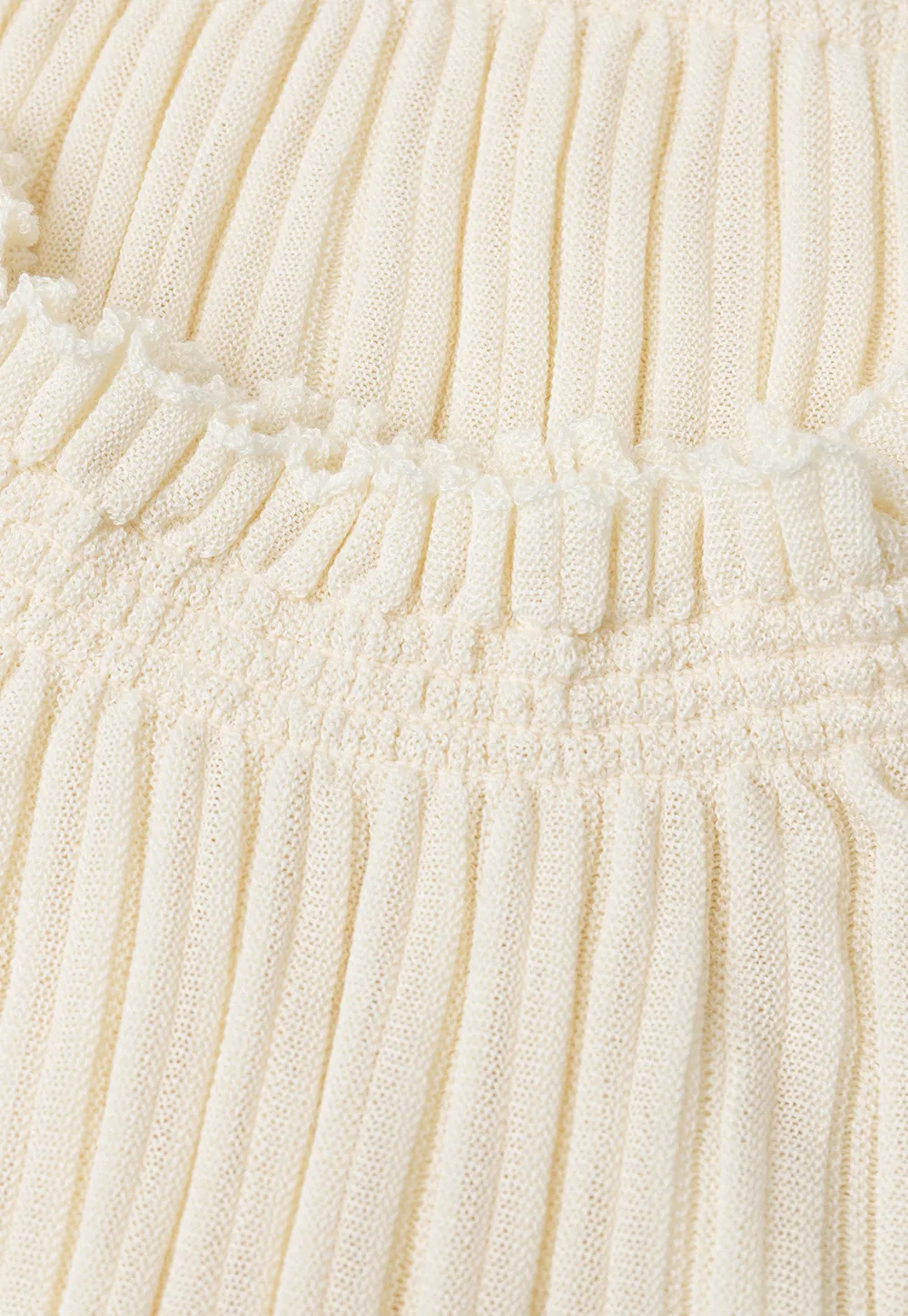 Ribbed Knit Sweater with Ruffled Hem and Flared Sleeves