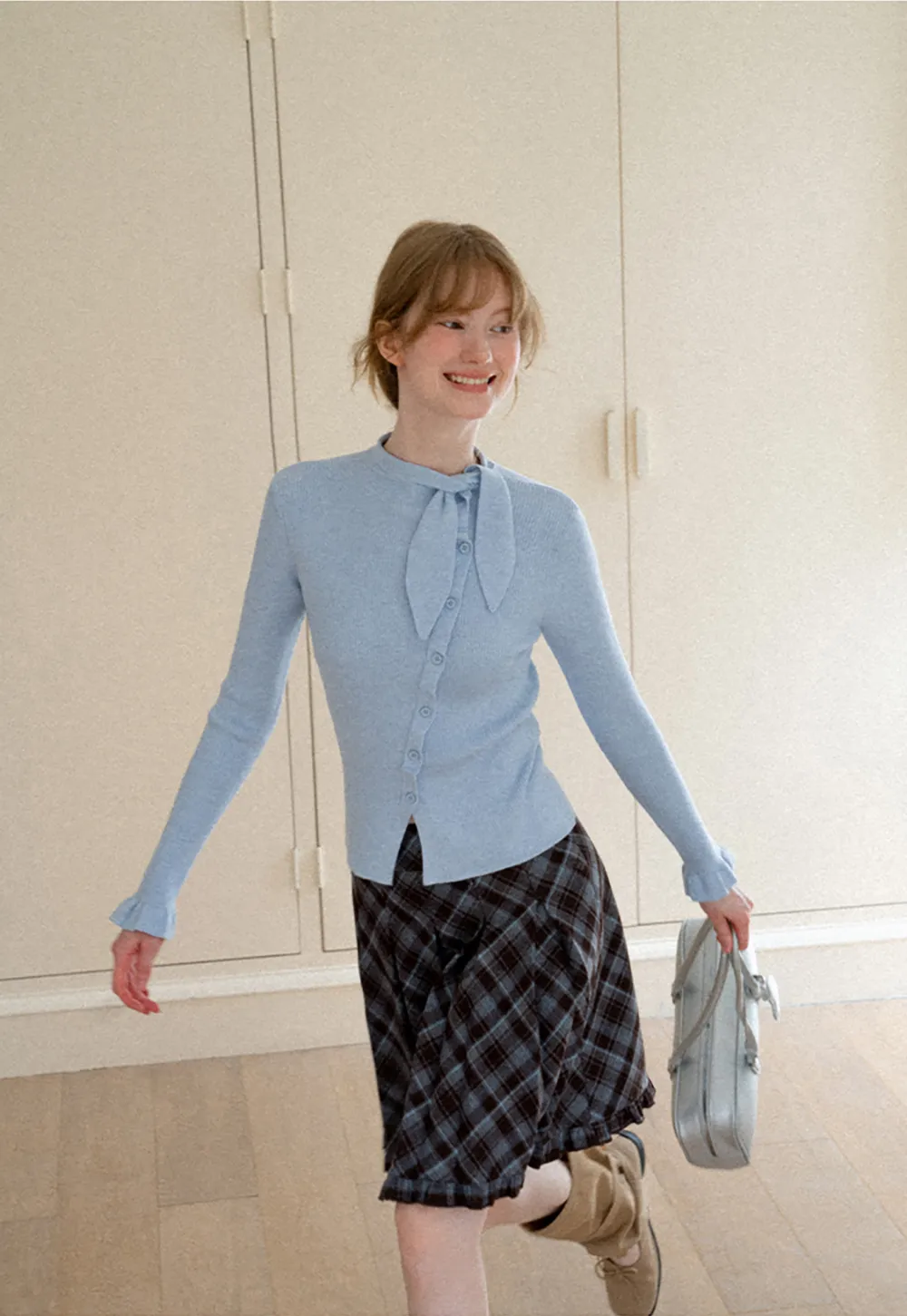Ribbed Knit Cardigan with Bow Tie Neck and Ruffled Placket