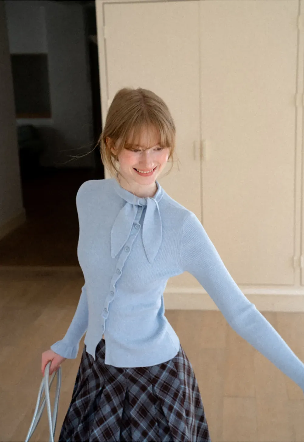 Ribbed Knit Cardigan with Bow Tie Neck and Ruffled Placket