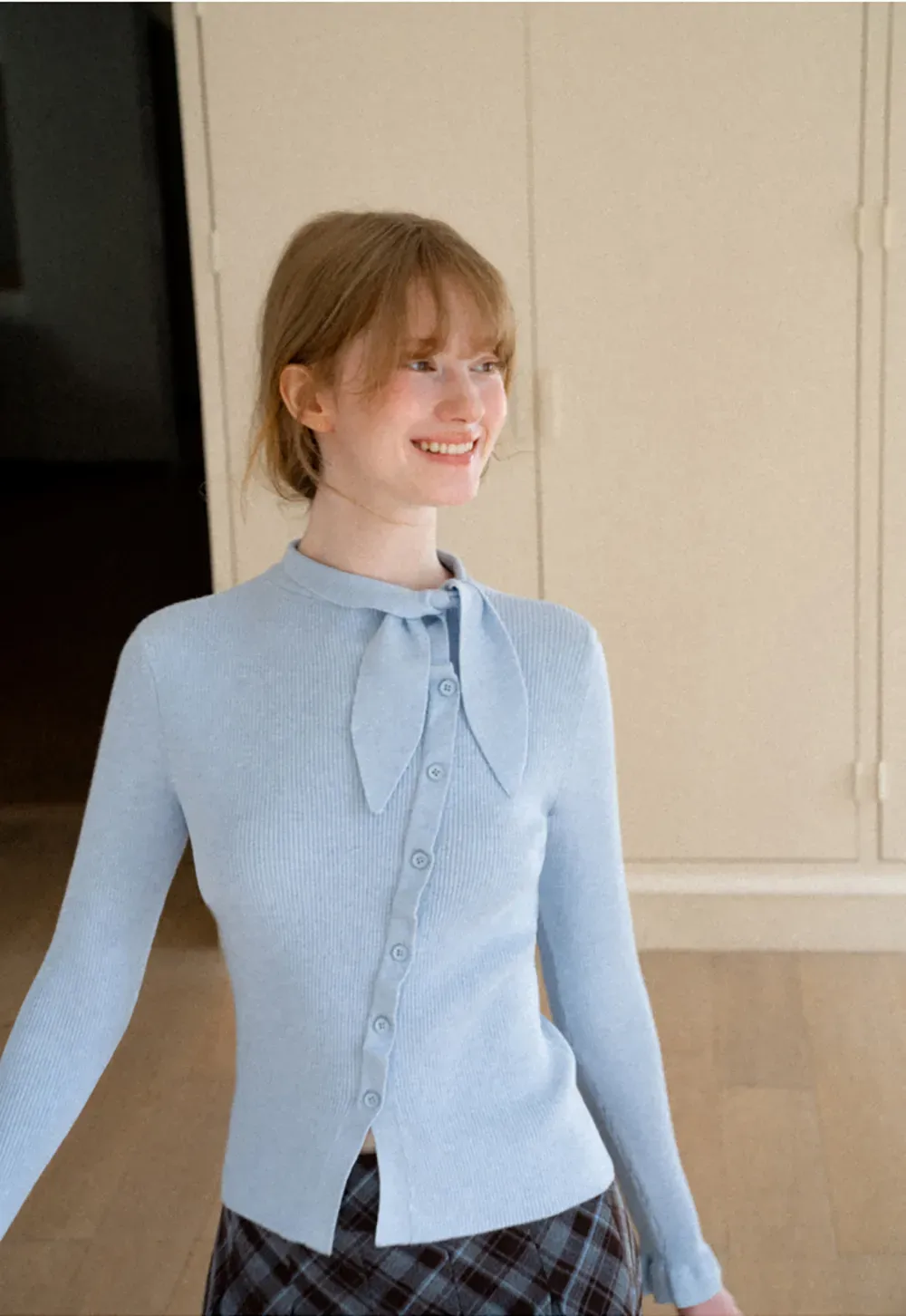 Ribbed Knit Cardigan with Bow Tie Neck and Ruffled Placket