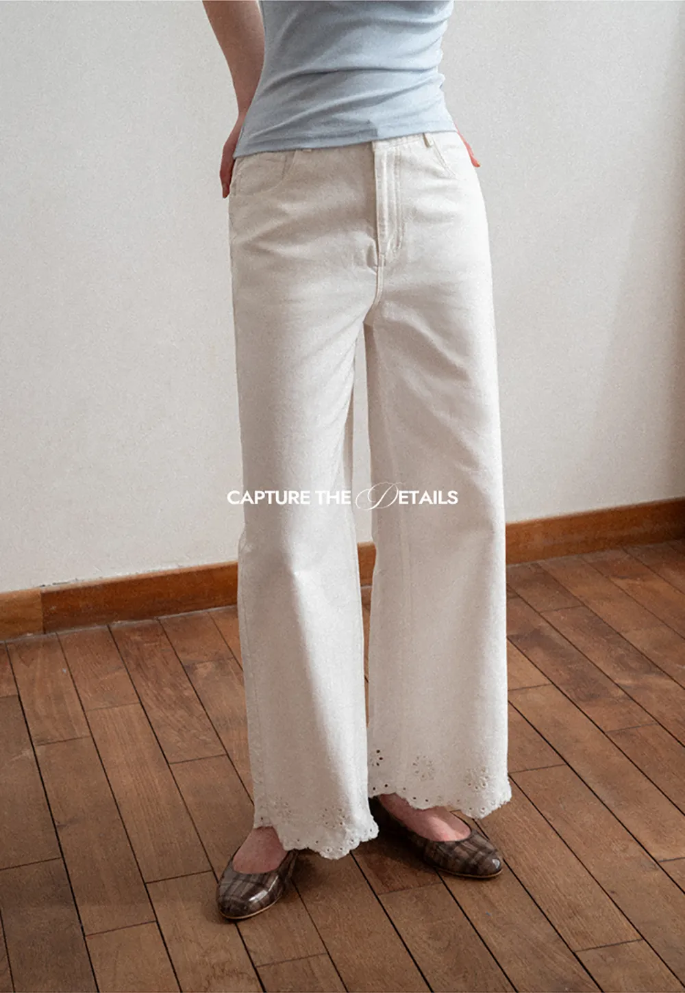 Wide leg jeans with embroidered hem details
