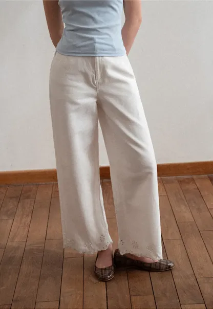 Wide leg jeans with embroidered hem details