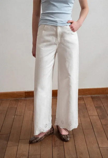 Wide leg jeans with embroidered hem details