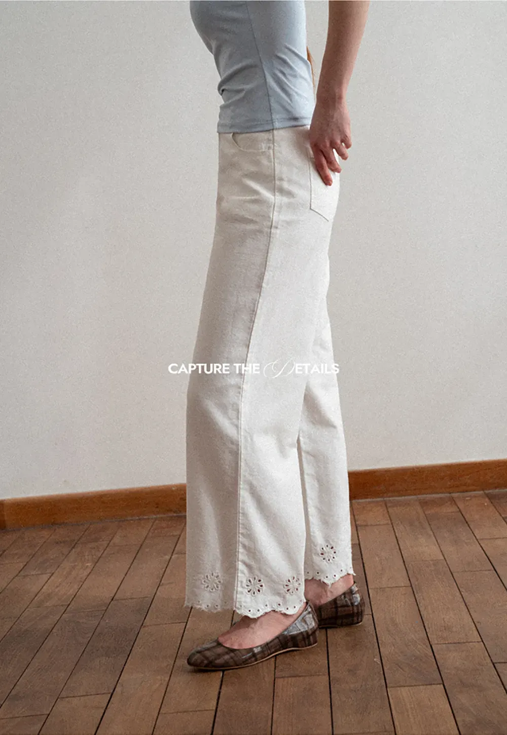 Wide leg jeans with embroidered hem details