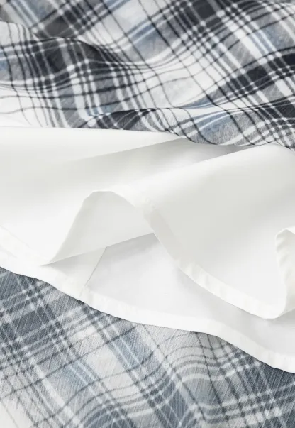 Plaid Skirt with Ruffled Hem and Asymmetrical Design