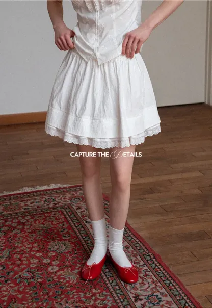 Tiered skirt with lace trim and gathered waist