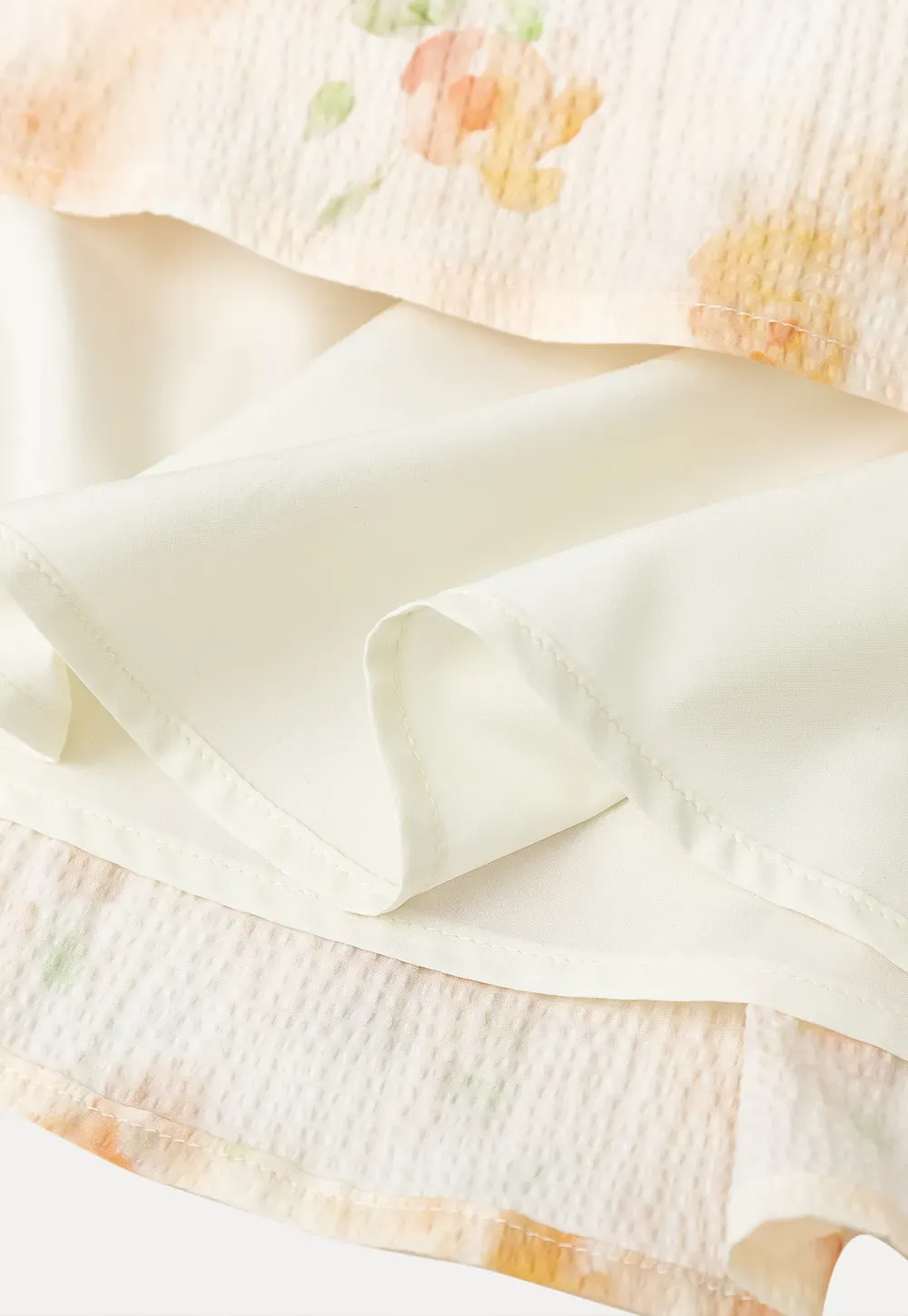 Floral Print Pleated Skirt with Asymmetrical Hem