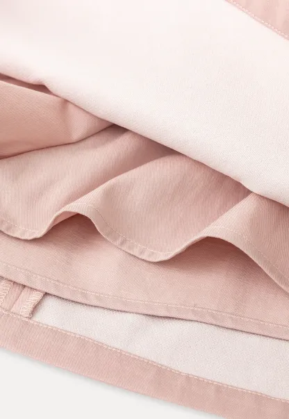 Short skirt with lace trim and button front