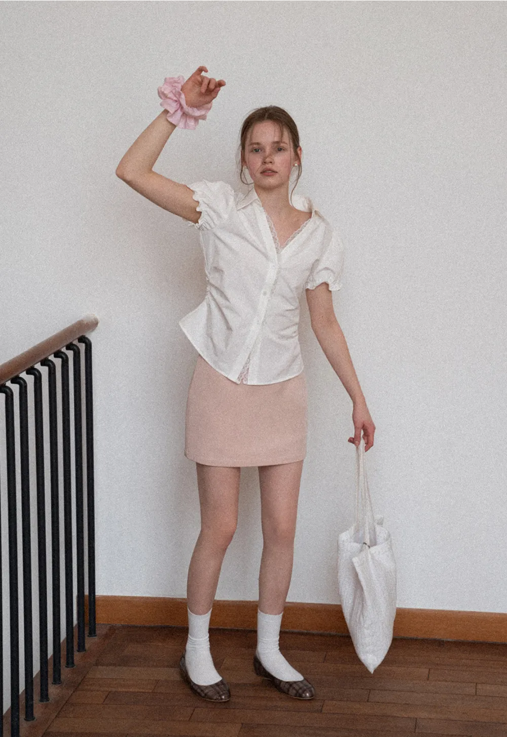 Short skirt with lace trim and button front