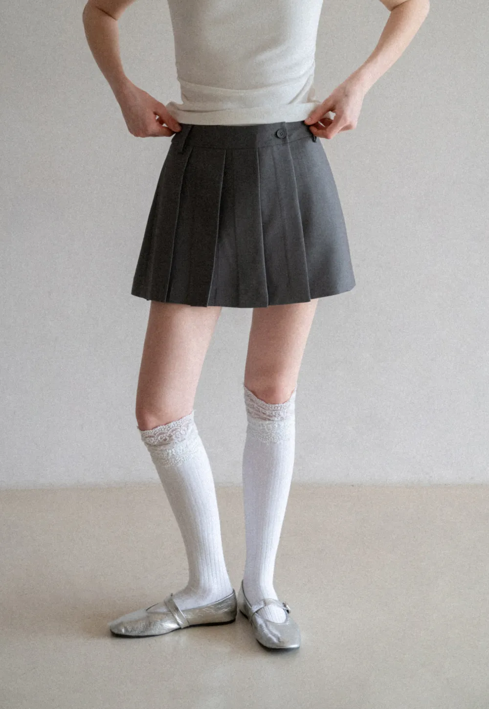 Pleated skirt with front button closure