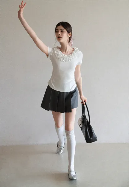 Pleated skirt with front button closure