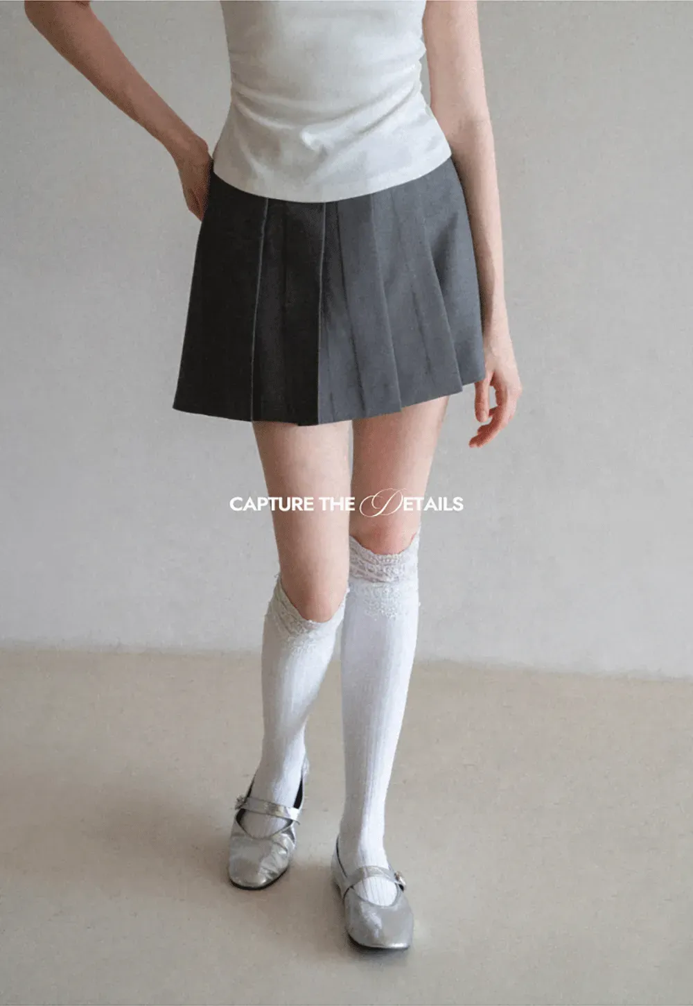 Pleated skirt with front button closure