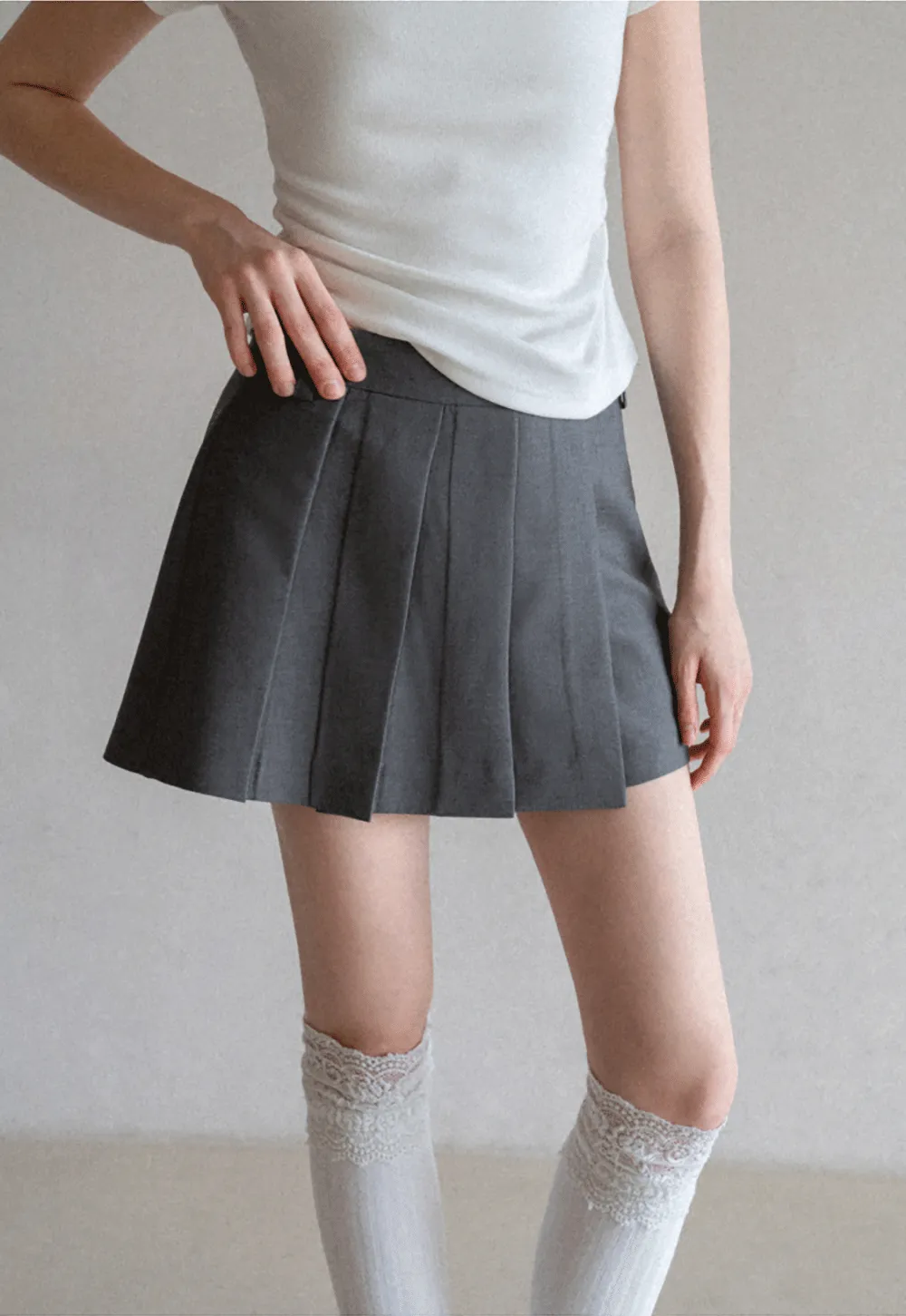 Pleated skirt with front button closure