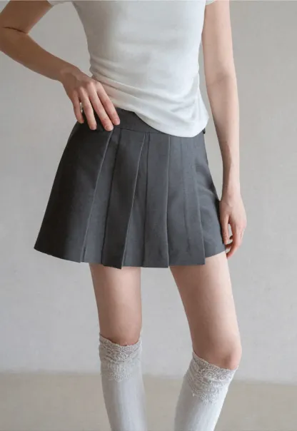 Pleated skirt with front button closure