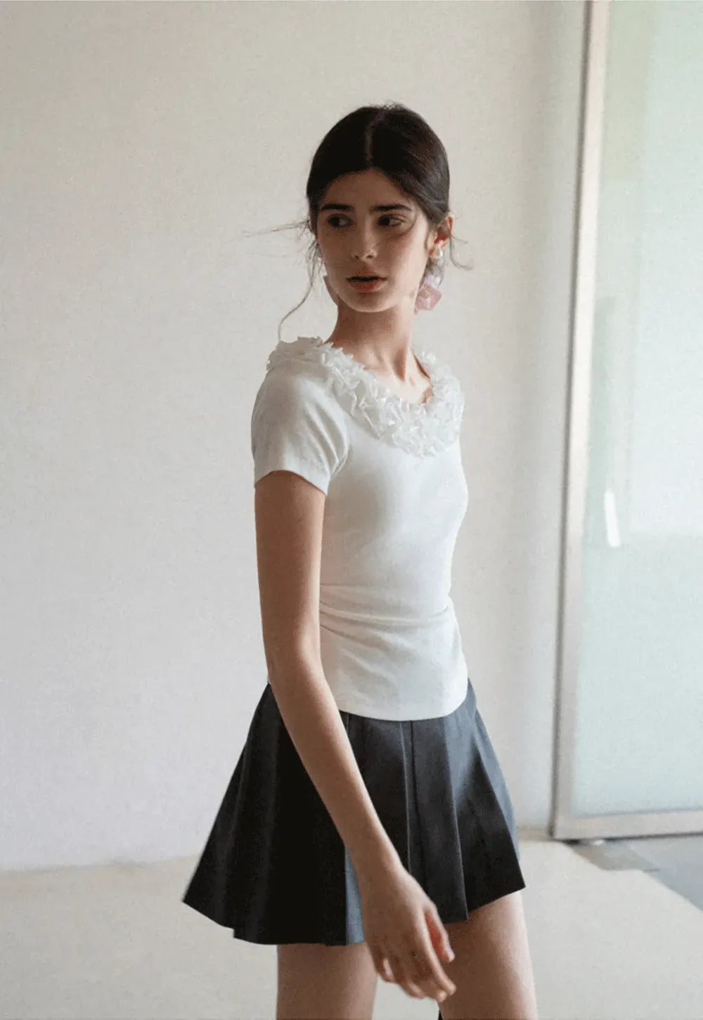 Pleated skirt with front button closure