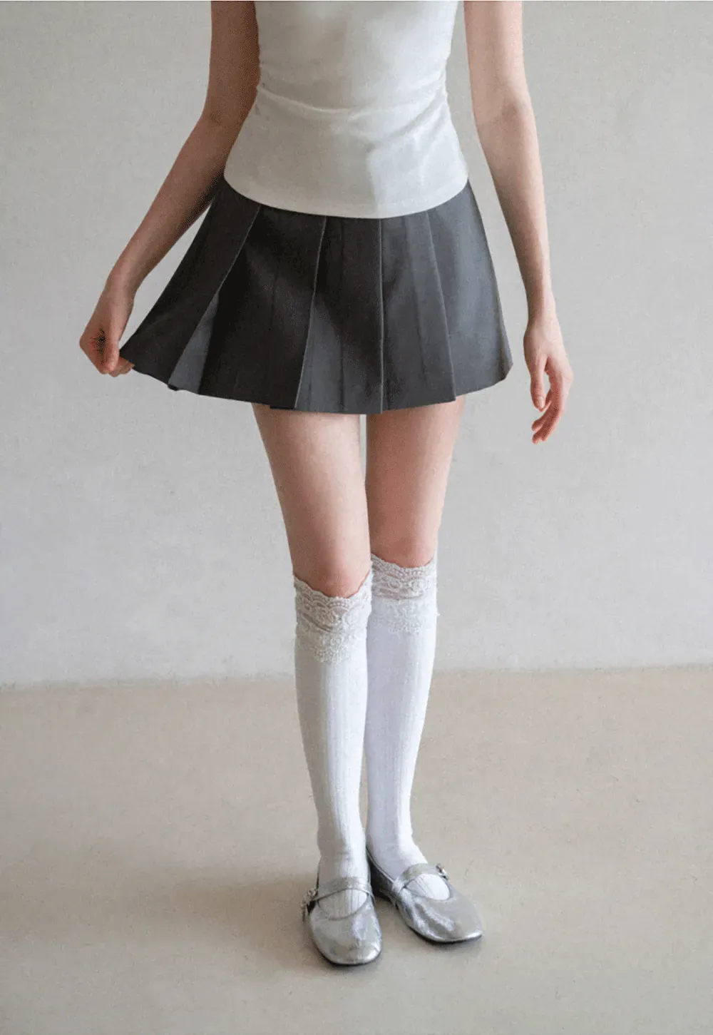 Pleated skirt with front button closure