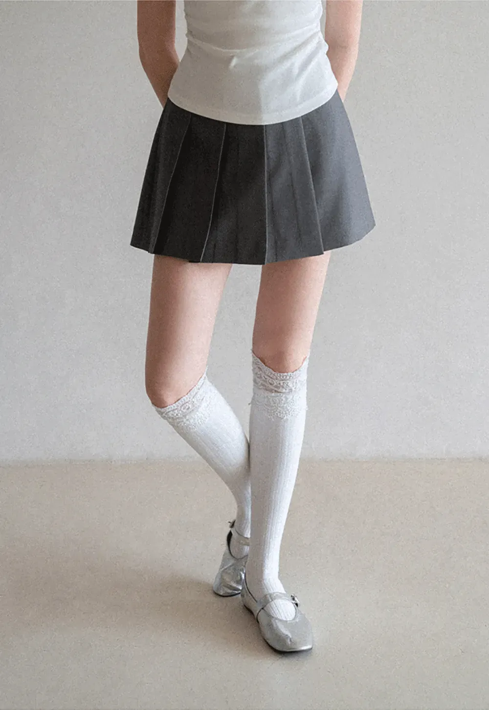 Pleated skirt with front button closure