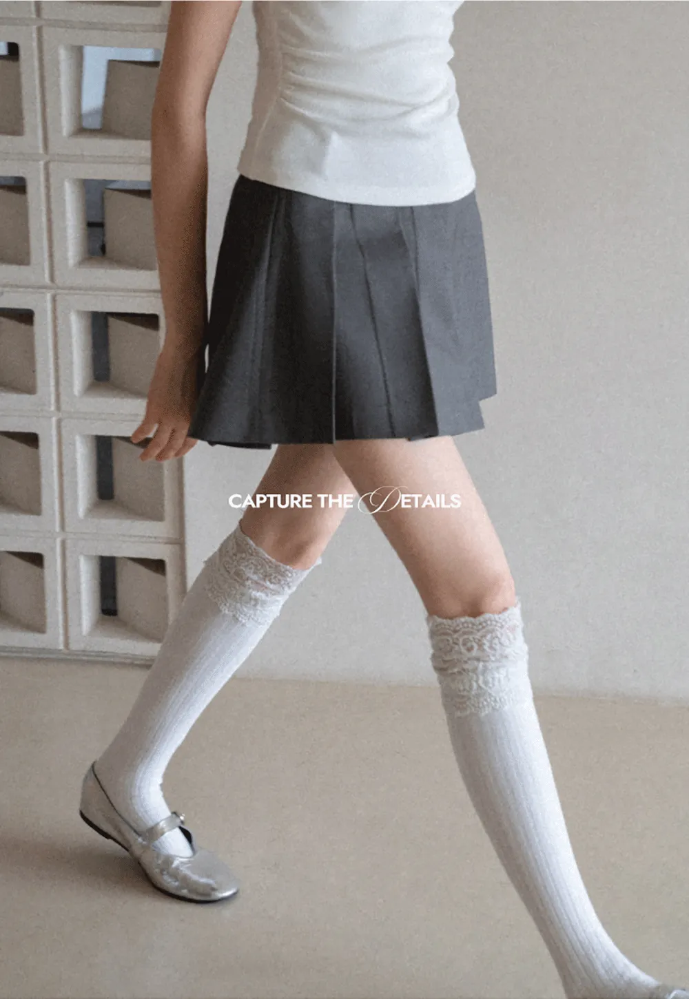 Pleated skirt with front button closure