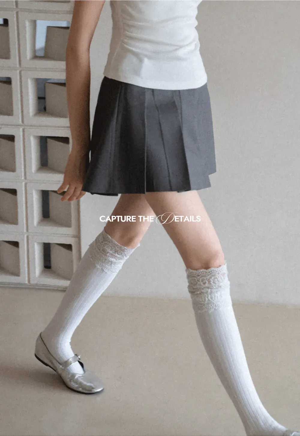 Pleated skirt with front button closure