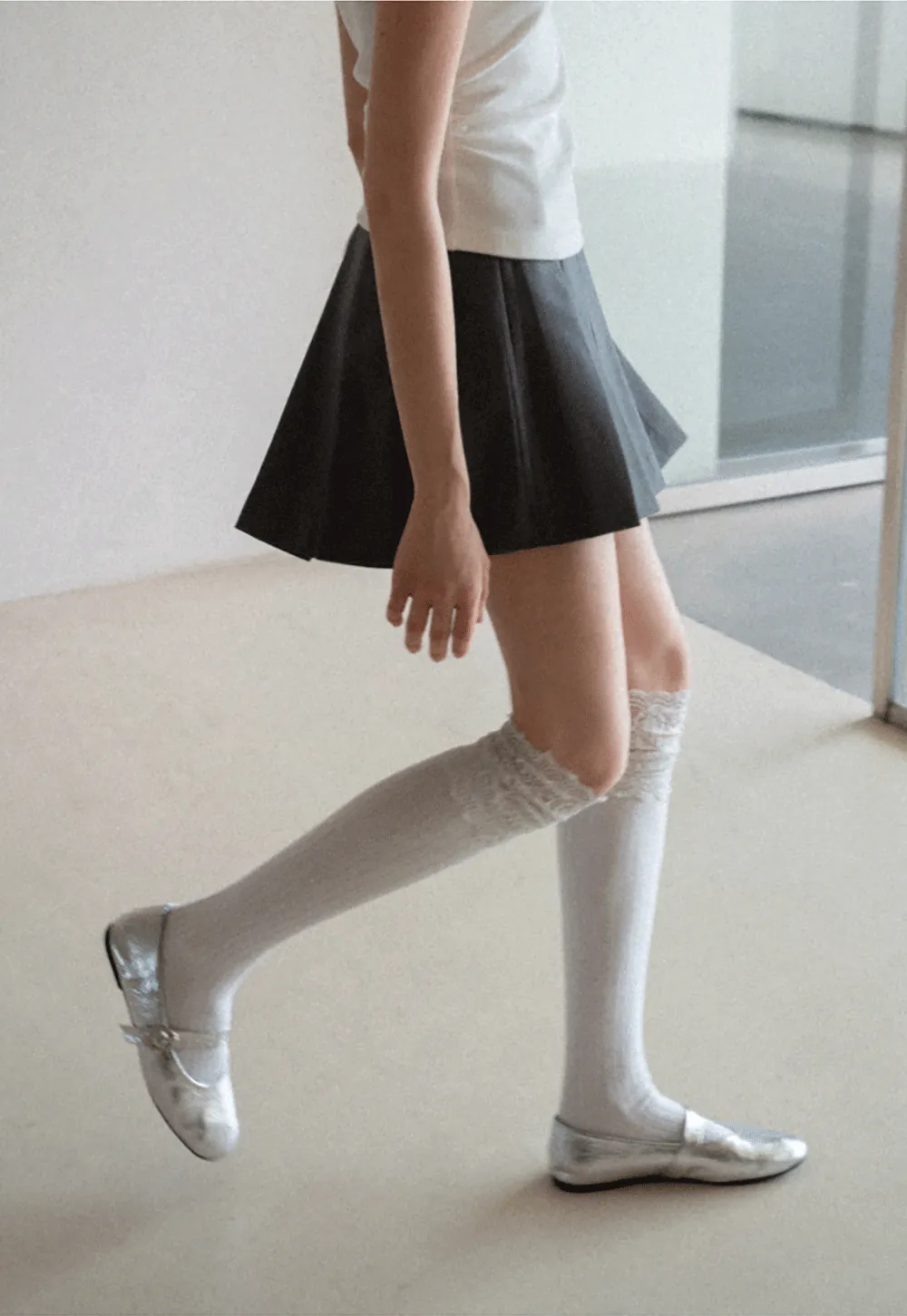 Pleated skirt with front button closure