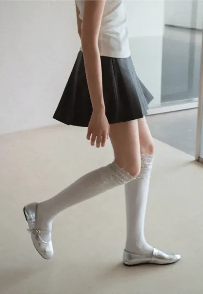 Pleated skirt with front button closure