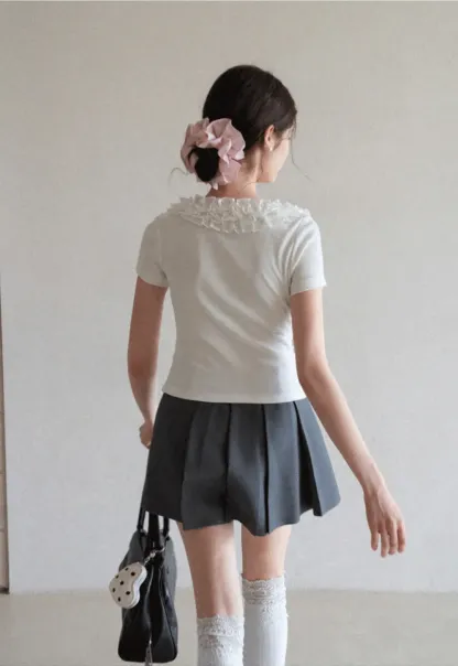 Pleated skirt with front button closure