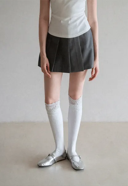 Pleated skirt with front button closure