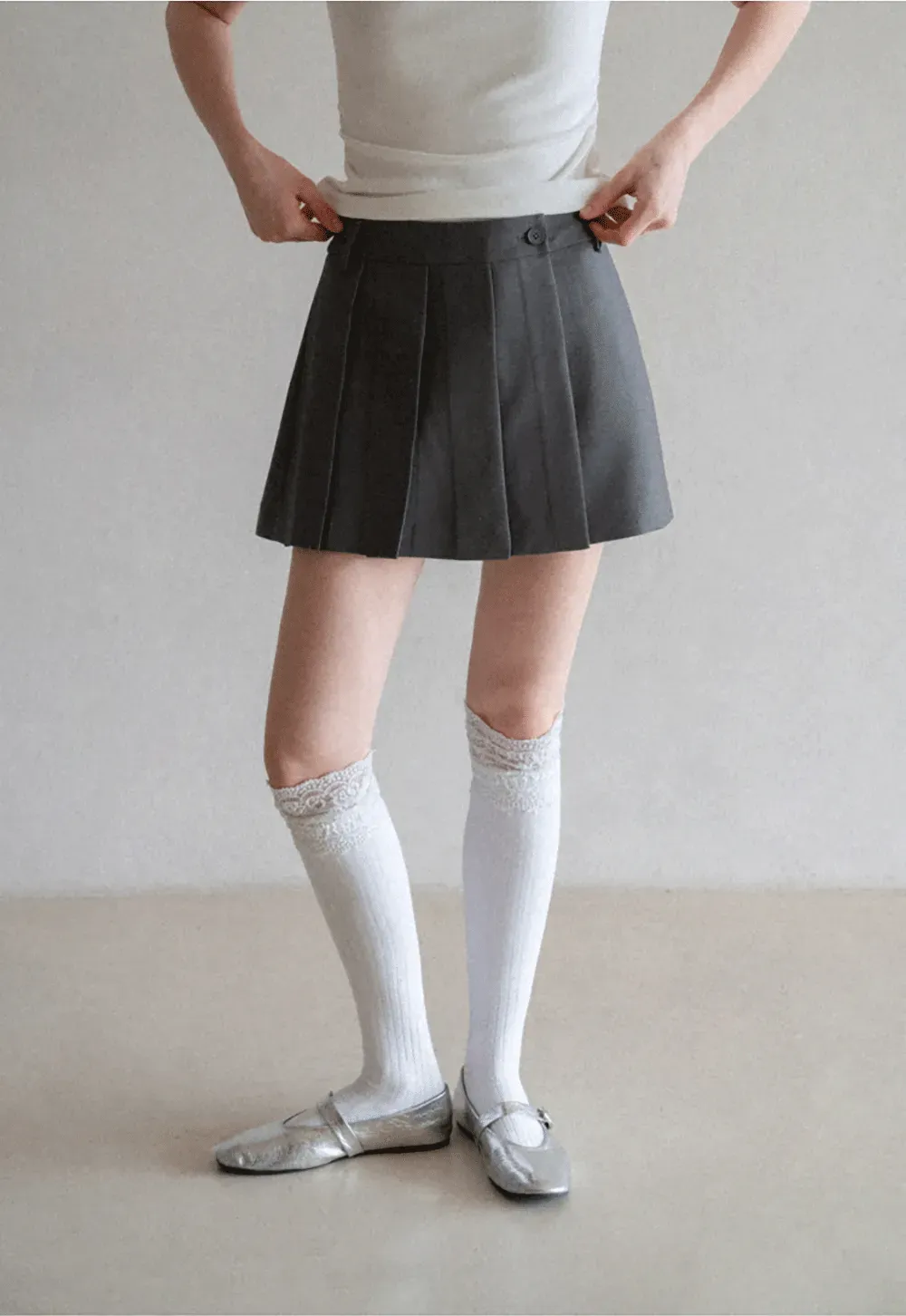 Pleated skirt with front button closure