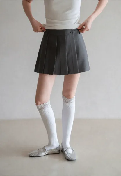 Pleated skirt with front button closure