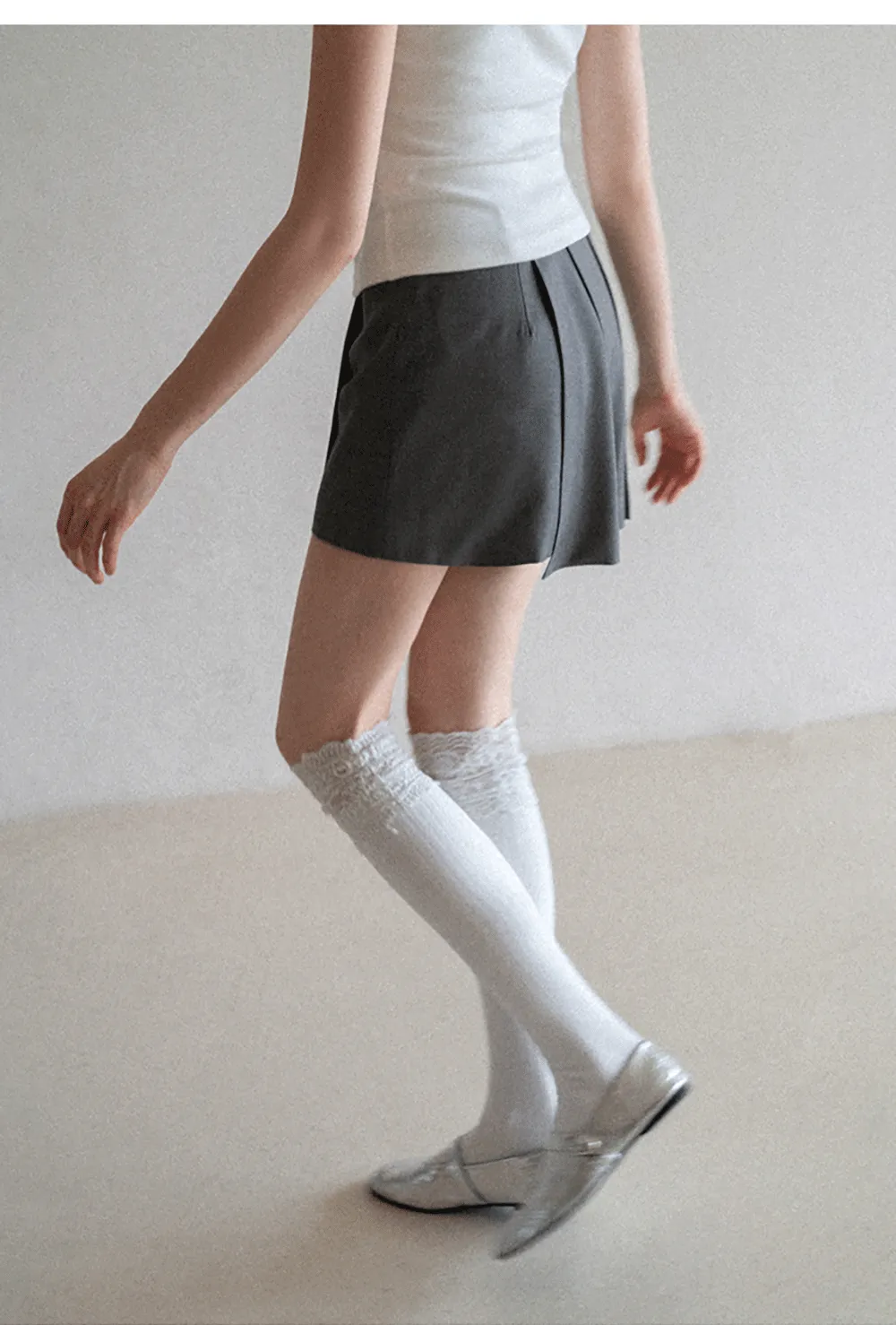 Pleated skirt with front button closure