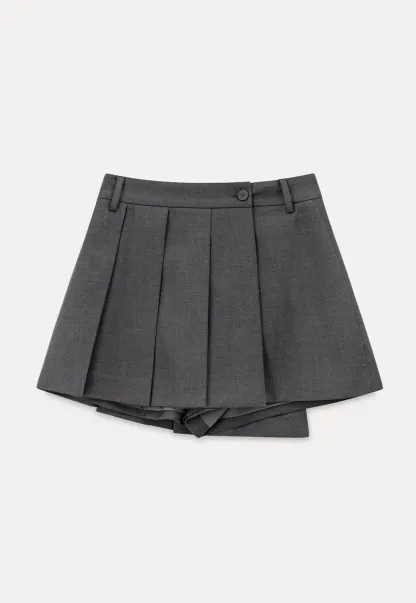 Pleated skirt with front button closure