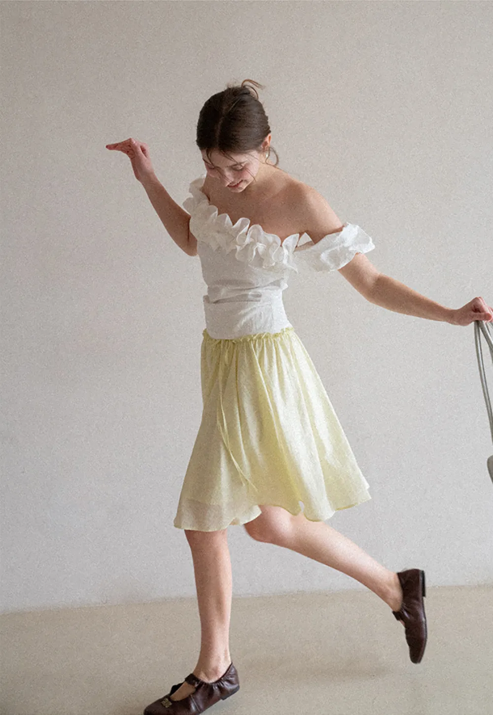 Flowy A-line skirt with gathered waist and layered hem