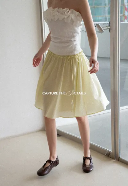 Flowy A-line skirt with gathered waist and layered hem