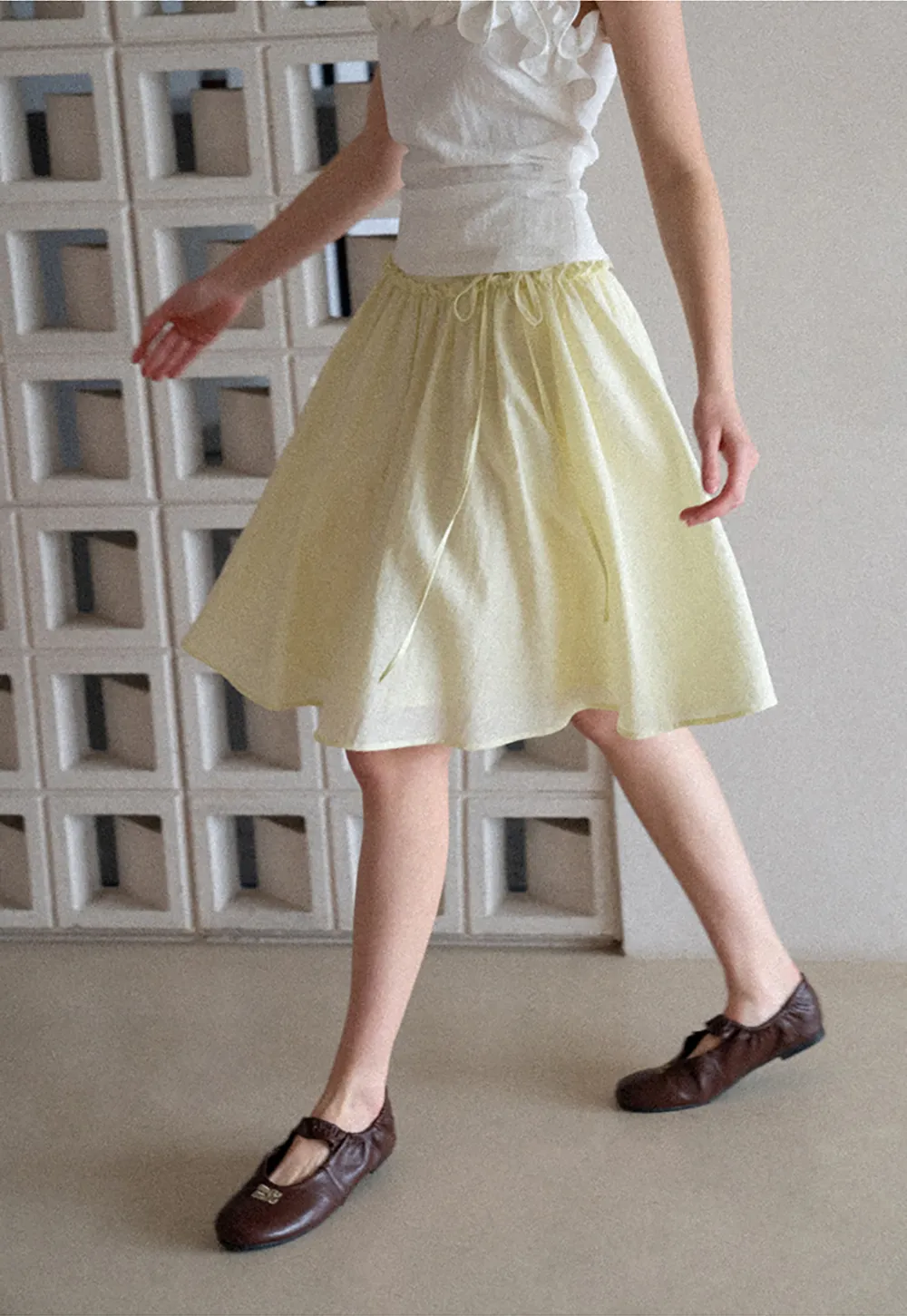 Flowy A-line skirt with gathered waist and layered hem