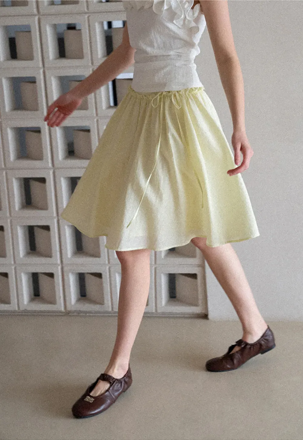 Flowy A-line skirt with gathered waist and layered hem
