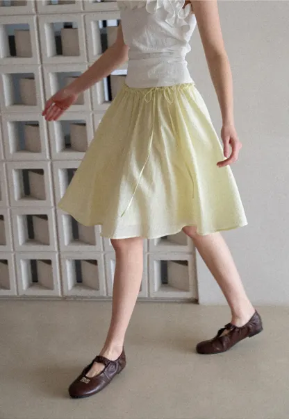 Flowy A-line skirt with gathered waist and layered hem