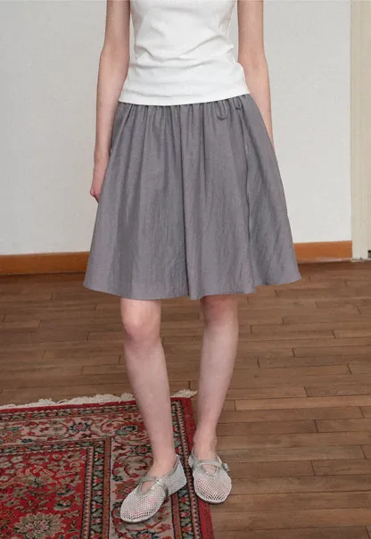 Flowy A-line skirt with gathered waist and layered hem