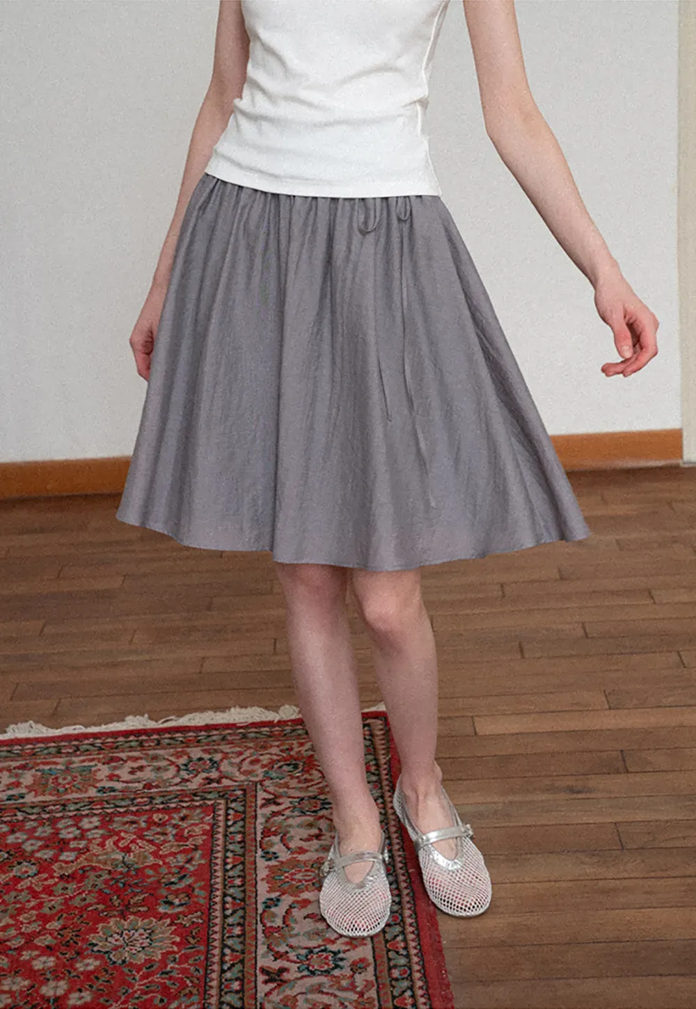 Flowy A-line skirt with gathered waist and layered hem