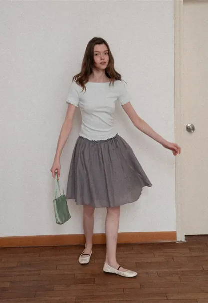 Flowy A-line skirt with gathered waist and layered hem