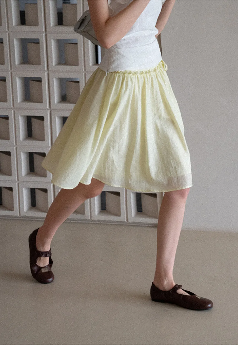 Flowy A-line skirt with gathered waist and layered hem